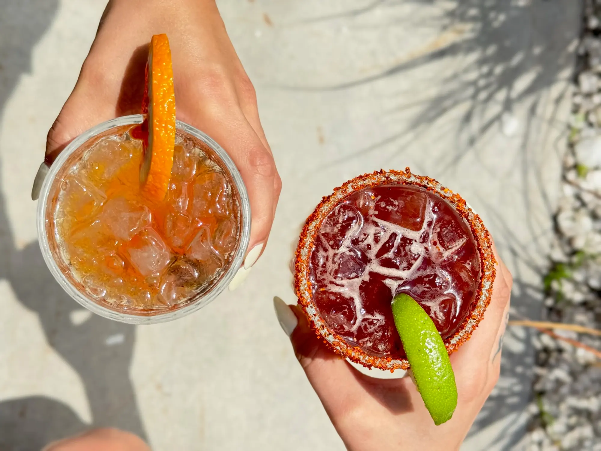 Two cocktails from above, citrus and a salted rim