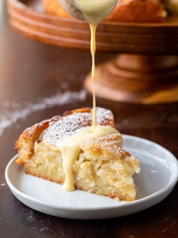Cream poured over a slice of cake
