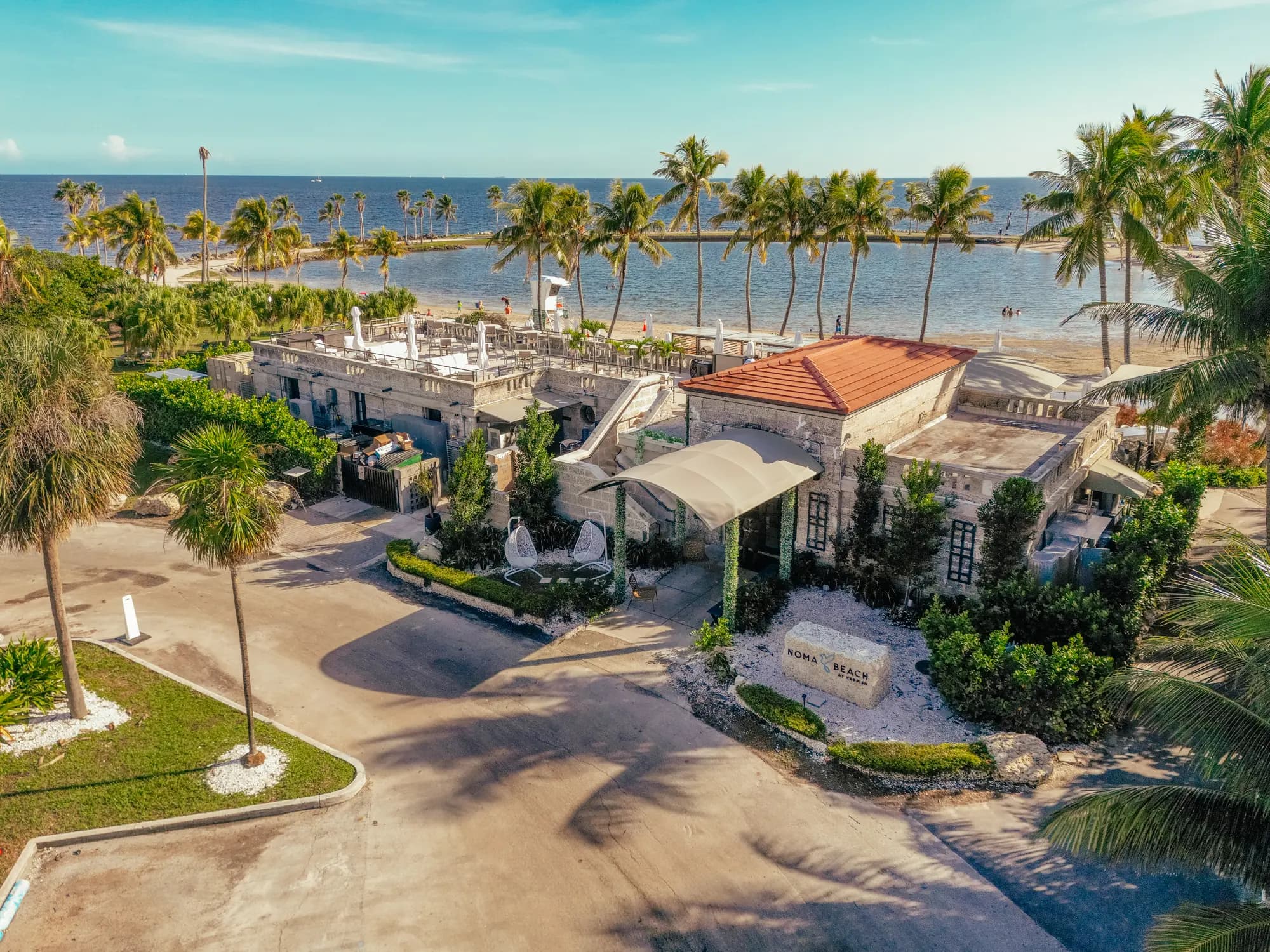 The coral-rock building from above, the lagoon and Biscayne Bay beyond