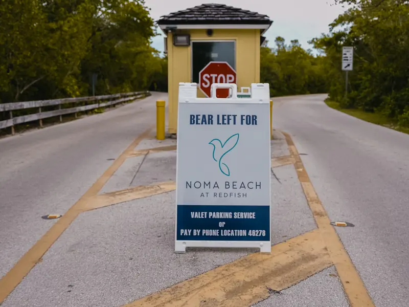 A sign in front of the park’s booth: bear left for NOMA BEACH