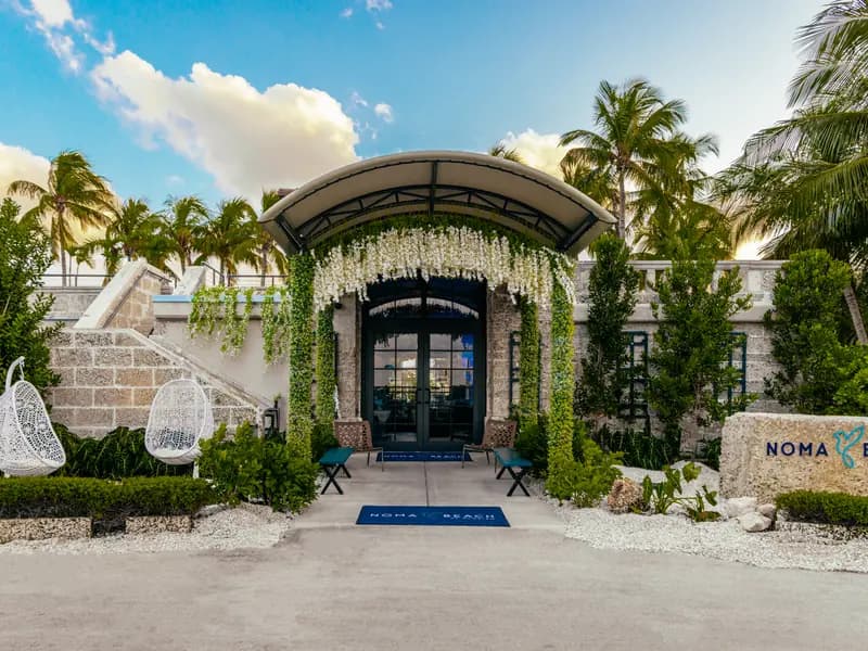 The restaurant’s entrance under its arch of vines